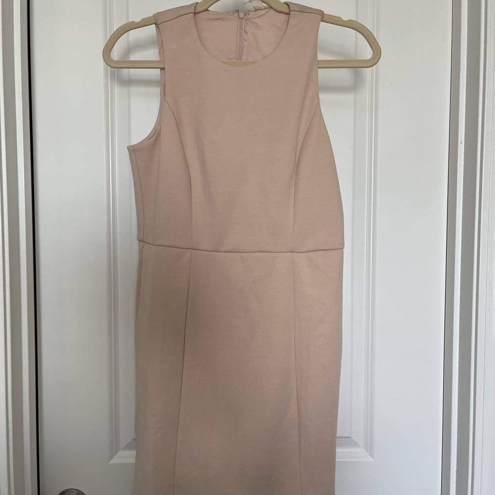 Blush color dress, the size is Medium it runs a little small.